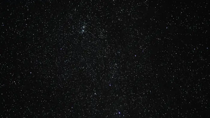 Earth's horizon glowing against the blackness of space